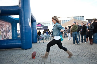 Inflatable games had guests kicking a field goal, throwing a pass, and racing outside in the tailgate area.