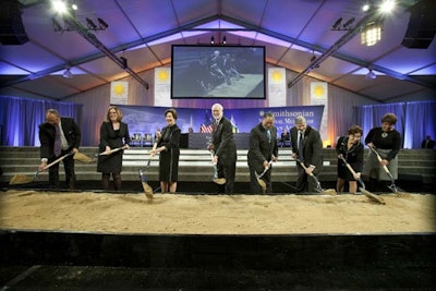 Former first lady Laura Bush, the museum's director Lonnie G. Bunch, and Smithsonian Institution's secretary Wayne Clough were among the groundbreakers who turned the soil Wednesday morning. Clark/Smoot/Russell, the museum's construction partners, donated the engraved groundbreaking shovels.