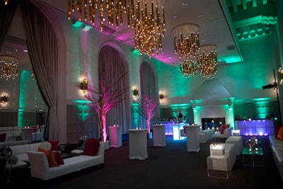 After the dinner, award presentation, and live auction, guests headed to a separate ballroom. With candlelight, glowing bars, and rosy trees, the space had the look of an enchanted forest. Kehoe brought in white lounge furniture strewn with jewel-hued pillows, and later in the night servers passed baskets of seasoned French fries.