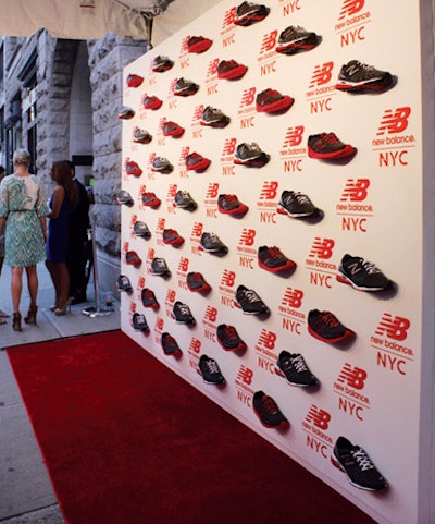 For the opening of New Balance’s first experience store in New York in August, the red carpet backdrop at the V.I.P. preview incorporated real running shoes mounted to a wall printed with the shoe brand’s logo.