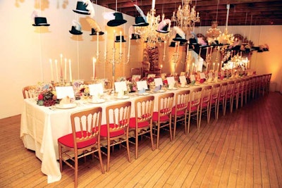 At a dinner following the spring collection presentation of Lanvin designer Alber Elbaz at the Carondelet House in Los Angeles in November, ExtraExtra suspended decorative feathered hats among chandeliers above the table. This caption has been updated to credit ExtraExtra.