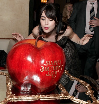 The event acknowledged star Lily Collins' birthday with a giant, apple-shaped cake.