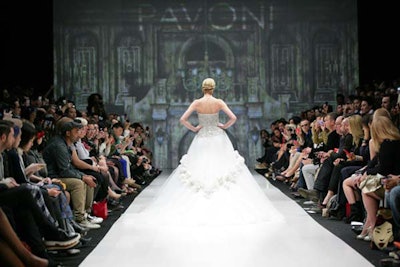 Pavoni closed its show with an ornate gown. The backdrop was designed to look like a mansion's grand foyer and added to the collection of elegant eveningwear.