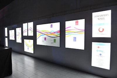 The illuminated discovery wall at the rear of the dining room displayed the history of Canadian stem cell research, beginning with its discovery at the University of Toronto.