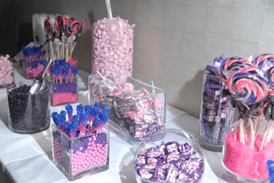 A candy bar held pink-and-purple goodies. Ribbons on the jumbo lollipops were branded with the eDrop-Off logo, as were plastic candy bags.