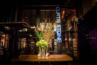 The chef's name illuminated the entrance to the event. Dolce Designs Studio, a Los Angeles-based company, provided the floral arrangements.