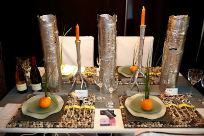 The Domoore Designs table incorporated river rock place mats and place cards tucked inside seashells.