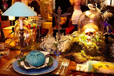 Alexa Stevenson styled an ambitious table for the New York Design Center titled 'Guess Who’s Coming to Dinner?' Nine of N.Y.D.C.’s Access to Design designers imagined cheeky place settings for their dream (deceased) dinner party guests, including Coco Chanel, Elizabeth Taylor, and Steve Jobs. Imagined to be set in a glamorous, haunted mansion, the macabre centerpiece included moss, succulents, and a skull inside a glass cloche.