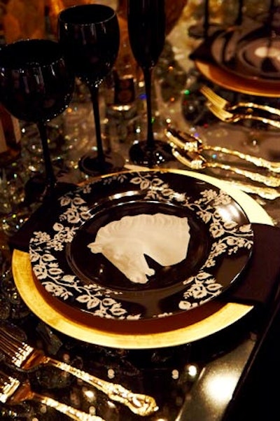 Gold flatware was a popular choice for many designers. HBA's space had a strong gold-and-black color scheme, with gold chargers and utensils, and opaque black glasses.