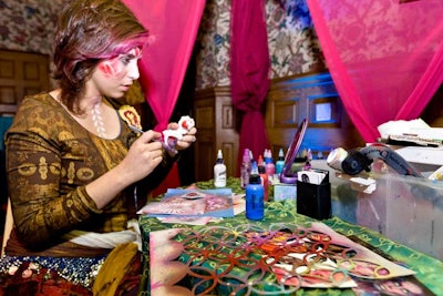 A face painter, a henna tattoo artist, and a palm reader entertained guests on the second floor of the temple.