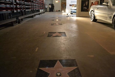In keeping with the event's Tinseltown cinema aesthetic, Mercedes created its own 30-star Hollywood Walk of Fame, replacing the usual celebrity names with the name and year of a film that featured an SL vehicle.