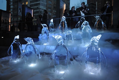 Also placed outside the event's venue was an eye-catching ice sculpture of penguins. The creation of the frozen pieces during the day drew crowds.