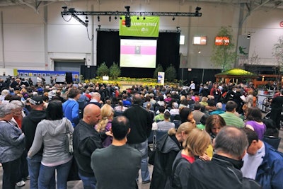 Sponsored by HGTV, the 'Unlock Celebrity' stage is lined with trees, daffodils, and tulips.