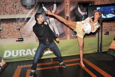 At one station, taekwondo champions Diana Lopez and Mark Lopez showed off their moves, while TV screens displayed highlights from past competitions.
