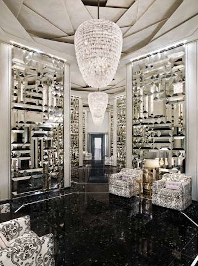 The resort's dramatic entrance has luxurious furnishings, light fixtures, and textured mirrored walls.