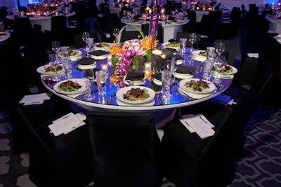 Mirror-top tables reflected the color-changing lights in the ballroom, a nod to the evening's theme of change.