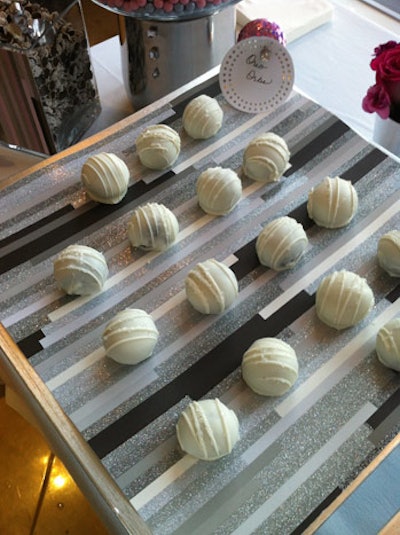 A dessert buffet held Oreo balls, made with crushed cookies covered in white chocolate.
