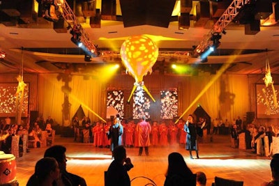 The ballroom at the JW Marriott Marquis turned from red to yellow as the Miami Choral Academy, children, and singers Anna Palmerola and Cristal Abreu performed on the dance floor for guests after dinner.