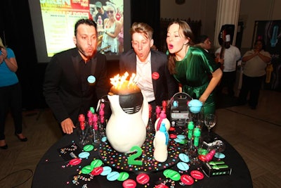Bobble co-founders Richard and Stephanie Smiedt, along with communications and events manager Asher Finkell (center), blew out the birthday cake's candles.