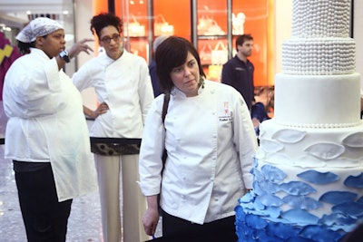 Judges Carla Hall of ABC's The Chew and Heather Chittum Roth of Top Chef: Just Desserts examined the Atlantis-themed cake by Padua Player, executive pastry chef for Susan Gage Caterers.