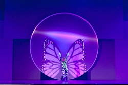 A dancer appeared to be attached to butterfly wings that moved on the screen behind her. Corporate Magic's Stephen Dahlem said they created the effect by first recording a dancer in front of a green screen in order to determine placement of the wings.