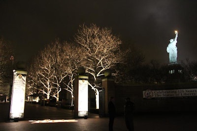 Further into Liberty Island, more lighting and projections helped lead attendees to the event's location. The illumination of Lady Liberty added to the evening's atmosphere.