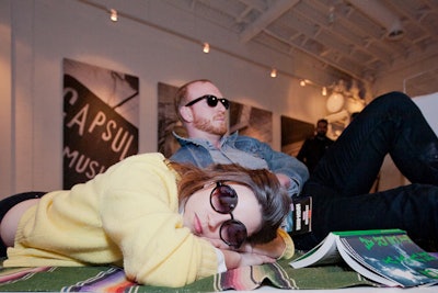 As part of the living-art performance, two models relaxed on the floor of the main gallery space, recreating a common sight in nearby Trinity Bellwoods Park.