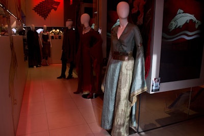 Mannequins dressed in elaborate costumes by Michele Clapton are showcased around the shop. The display is designed to play up a future clothing line inspired by the series.