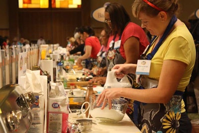 Contestants in the Pillsbury Bake-Off worked side-by-side to prepare their entries inside a ballroom at the Peabody Orlando Monday.