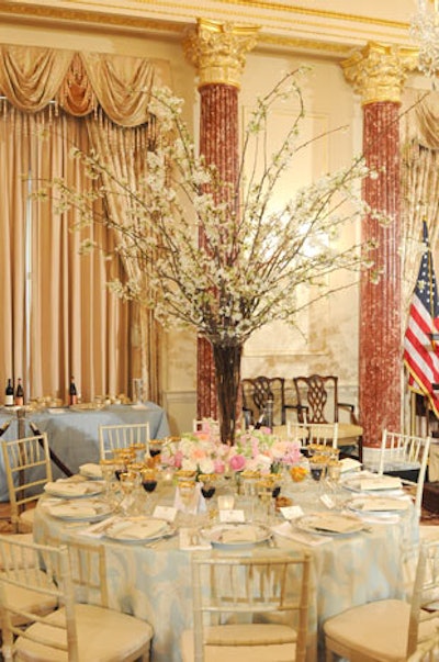 Tall quince branches topped select tables in the Benjamin Franklin State Dining Room for Wednesday’s 250-guest State Department luncheon honoring David Cameron.