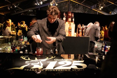 The surface of the main bar, a four-sided structure that stood at the center of the tent, was emblazoned with the Glenfiddich logo and imagery for the anniversary.