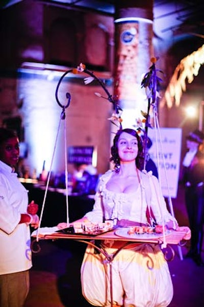 Meanwhile, a roving performer offered snacks from a tray that appeared to dangle from antlers affixed to her head.