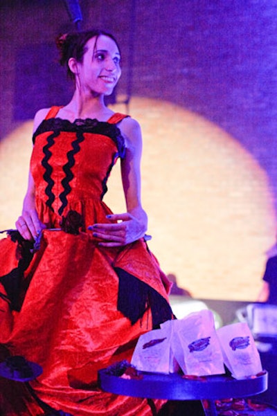 Of course, this being a Redmoon function, food wasn't only served at traditional stations. The company's 'Stilted Servers' are 10 feet tall and wear skirts made of sculpted steel, with attached trays that hold appetizers, desserts, promotional items, or, in this case, bags of Garrett popcorn.