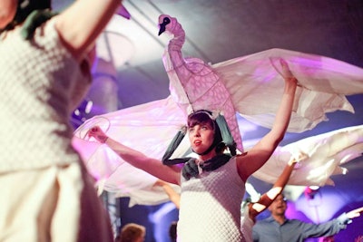 By moving their arms, the performers made the ghostly swans appear to fly.