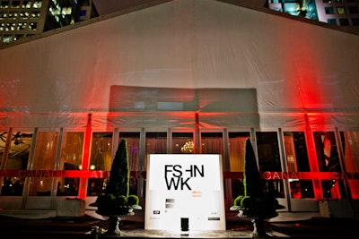 Topiary shrubs spruce up the exterior of the tent, and an illuminated sign showcases World MasterCard Fashion Week's new logo. This year, the tent is outfitted with two separate entrances, which helps with the flow of guest traffic.