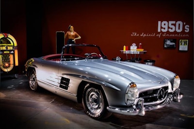 One of the highlights of the seven-vehicle exhibit was the inclusion of Natalie Wood's Mercedes SL from the 1950s. The car, which was shipped in from the East Coast, was displayed in a glossy red vignette that featured a jukebox and diner-style countertop tables and stools evocative of that decade.