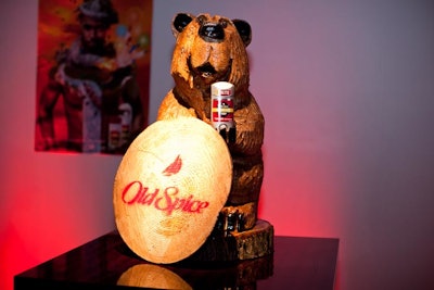 In addition to videos of its commercials playing on screens and posters from previous marketing campaigns decorating the walls, event visuals included tongue-in-cheek masculine props, like wooden bears, footballs, and plaid pillows.