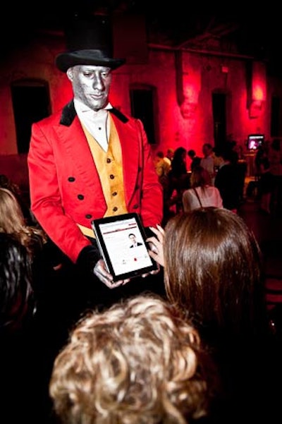 A man made to look like a statue stood on a pedestal with an iPad. The device allowed guests to navigate the Rogers Web site.