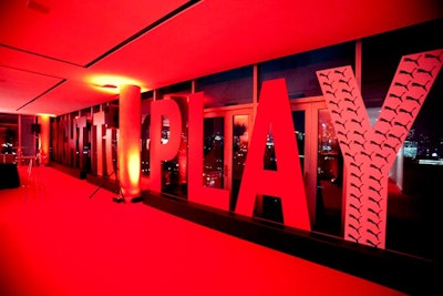 Large letters spelling out 'Right to Play' lined a wall of windows, allowing guests to see the city skyline in the background. The 'Y' was marked with the Puma logo, a nod to the headlining sponsor.