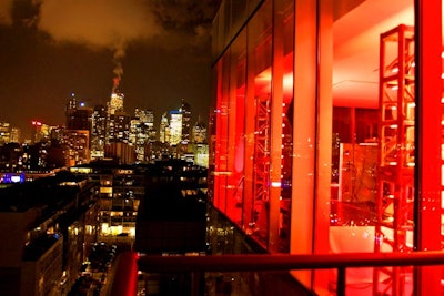 As a subtle way to incorporate the nonprofit organization's branding, the design team used a red, black, and yellow colour scheme and illuminated the Thompson Hotel penthouse with red lighting.