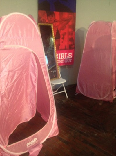 Pink pop-up tents served as changing areas where guests could try on clothes.