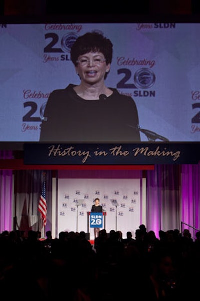 A 39-foot screen projected the images of those on the stage and later served as the scoreboard for the donation-pledge competition.