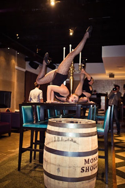 After the mixology competition, contortionists emerged from branded barrels and performed twisty tricks on tables throughout the space.