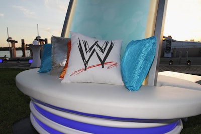 WWE branding was present on pillows strewn throughout the lounge area.