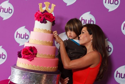 Host Brooke Burke cut a giant, wedding-style tiered cake.