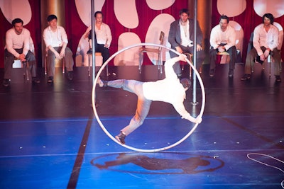Another performer from the Traces spun in a Hula-Hoop on the stage at the center of the atrium.