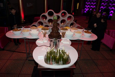 A chocolate fountain station included doughnut holes, strawberries, pineapples, and Rice Krispies treats.