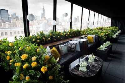 The terrace became the event's lounge area, with yellow roses, paper lanterns (which glowed with LED lights later in the evening), and fishbowl-shaped vases.