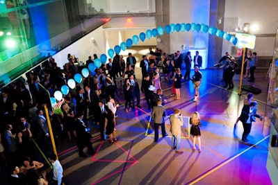 Artist Justin Broadbent created a glowing basketball court in the Weston Family Learning Centre. It was designed to feel like a high school basketball game, with cheerleaders and coaches lining the court.