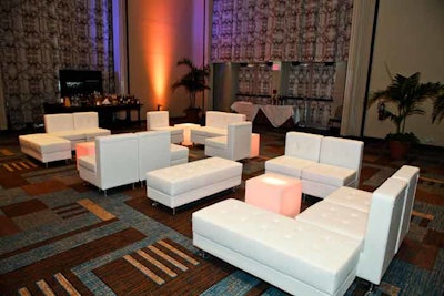 Atlas Party Rental designed the after-dinner lounge Saturday, accenting the room with purple lighting and plants.